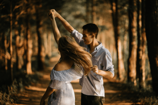 Couple dancing in forest